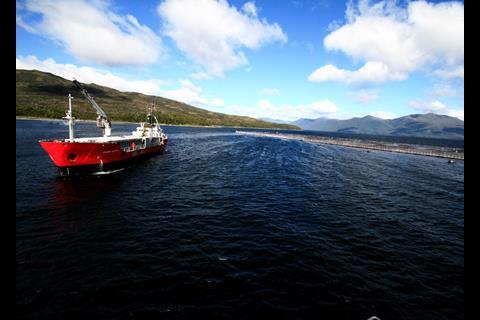 A Skretting boat arriving at a site in the Aysén region, southern Chile